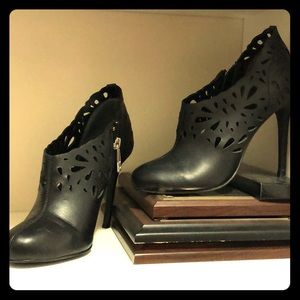 Black, leather bootie with laser cut detail.